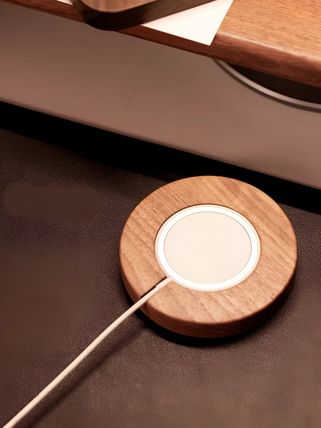 Walnut wood magnetic wireless charging bracket base on desk with phone