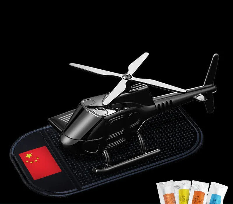 Helicopter car interior decoration model in silver colour on car dashboard