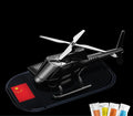 Helicopter car interior decoration model in silver colour on car dashboard