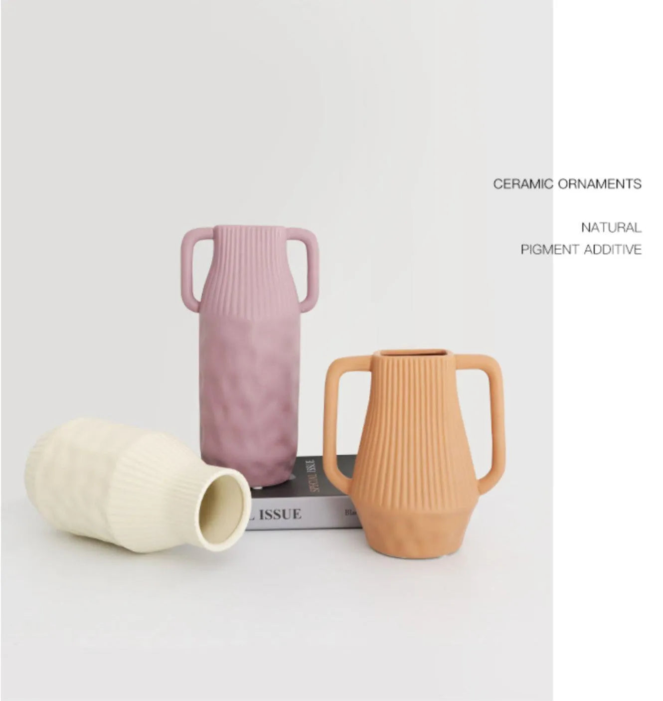 A simple hammer-textured ceramic vase in a Morandi colour on a wooden surface.