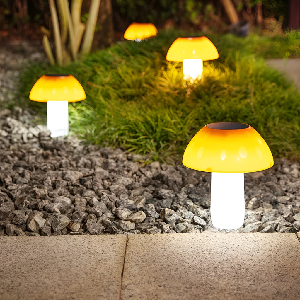 Solar garden mushroom light with ground spike for lawn and pathway illumination.