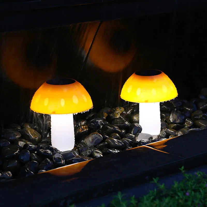 Solar garden mushroom light with ground spike for lawn and pathway illumination.