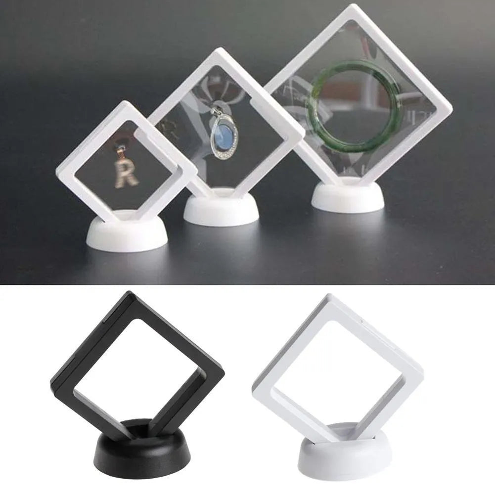 3D floating display case holding coins and jewellery between transparent membrane sheets