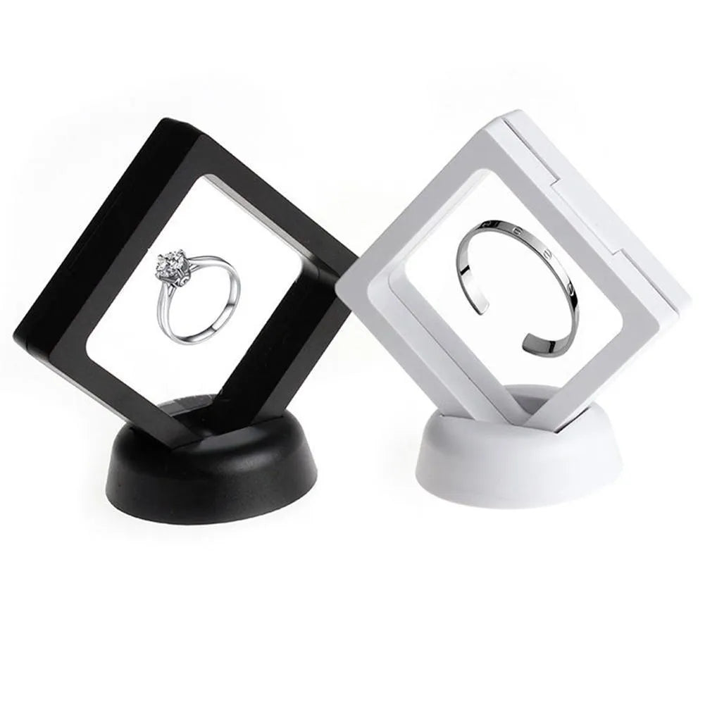 3D floating display case holding coins and jewellery between transparent membrane sheets