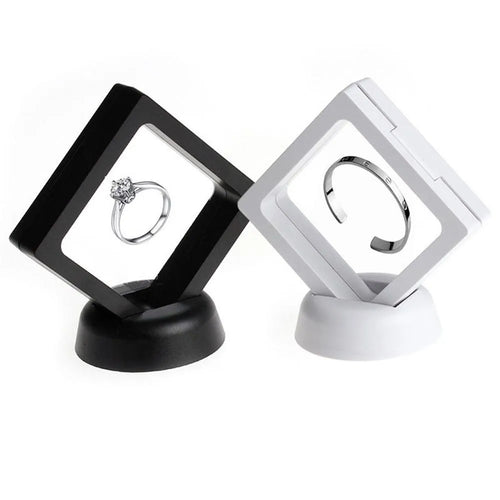 3D floating display case holding coins and jewellery between transparent membrane sheets