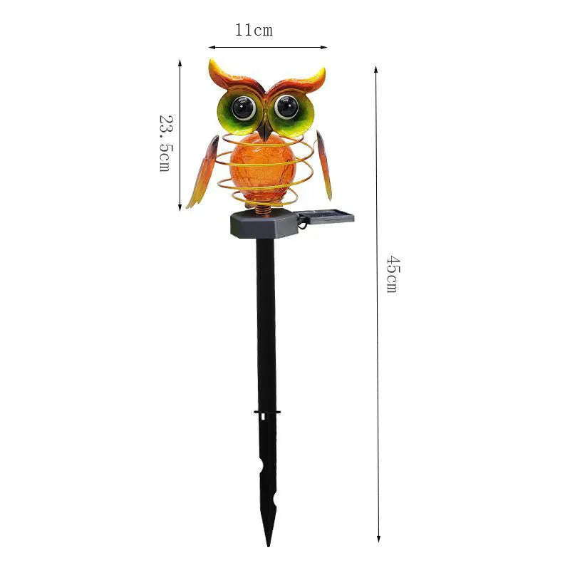 Solar owl lawn lamp with blue LED glow in garden pathway setting, 45cm tall