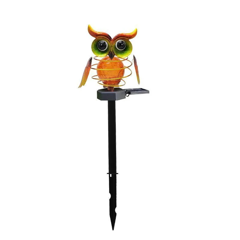 Solar owl lawn lamp with blue LED glow in garden pathway setting, 45cm tall
