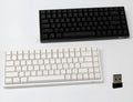 White 84-key mechanical keyboard with white backlighting and red switches on a desk