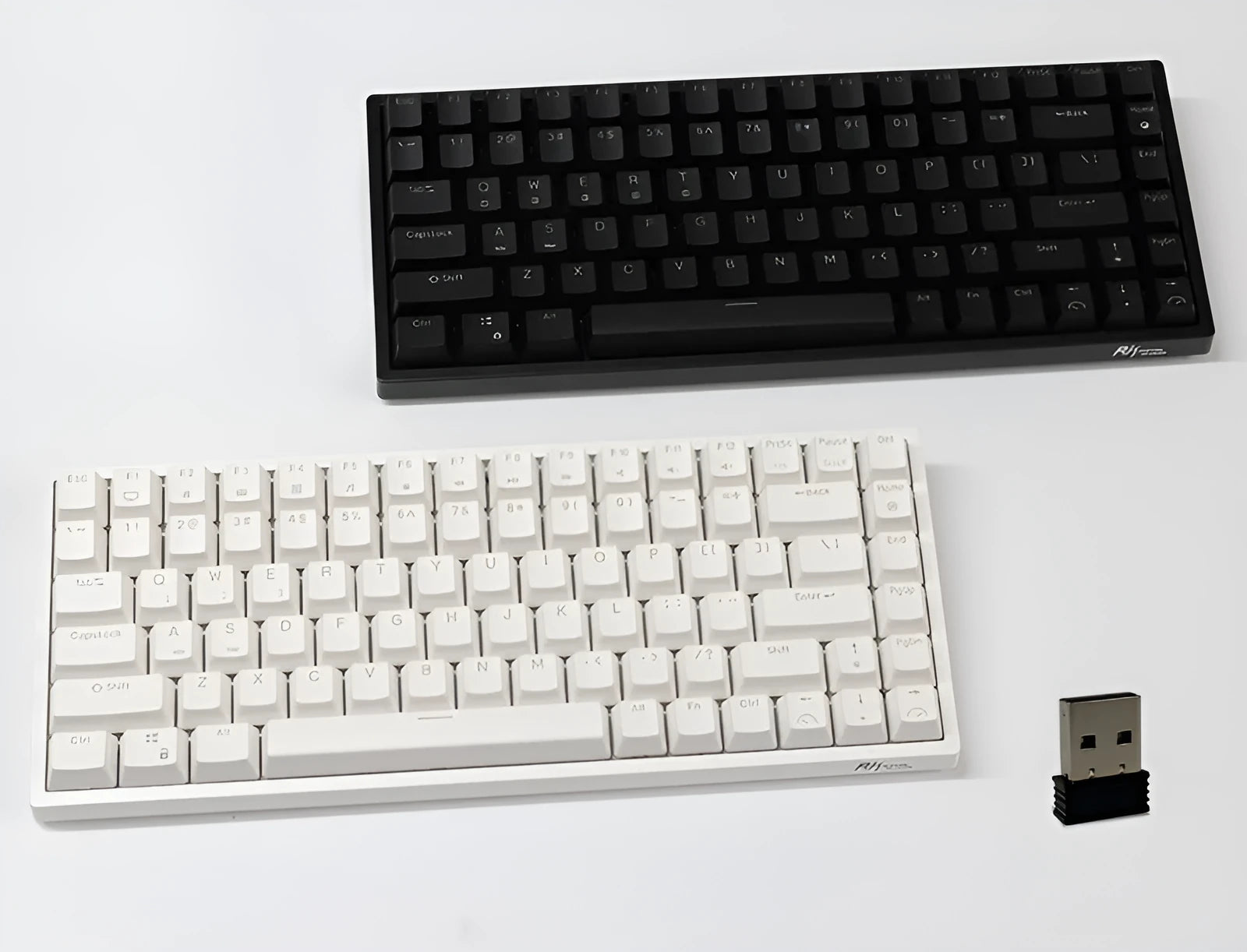 White 84-key mechanical keyboard with white backlighting and red switches on a desk