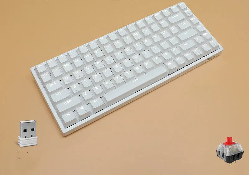 White 84-key mechanical keyboard with white backlighting and red switches on a desk