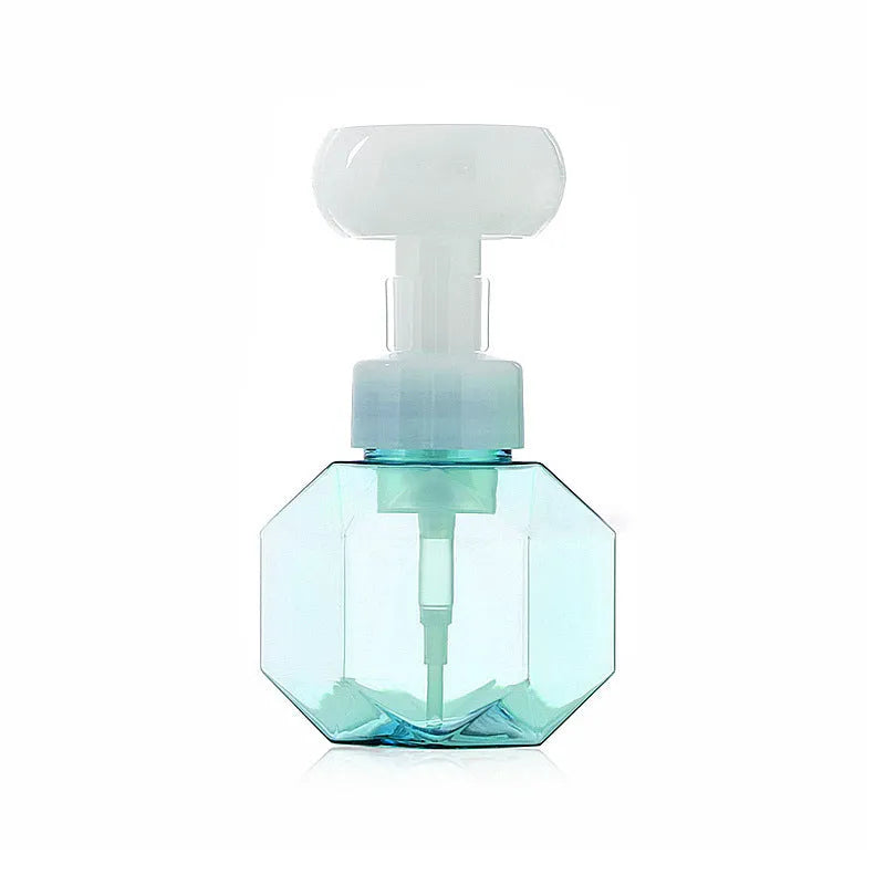 Refillable plastic foaming bottle for liquid soap in blue, green, pink and yellow colours.