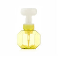 Refillable plastic foaming bottle for liquid soap in blue, green, pink and yellow colours.