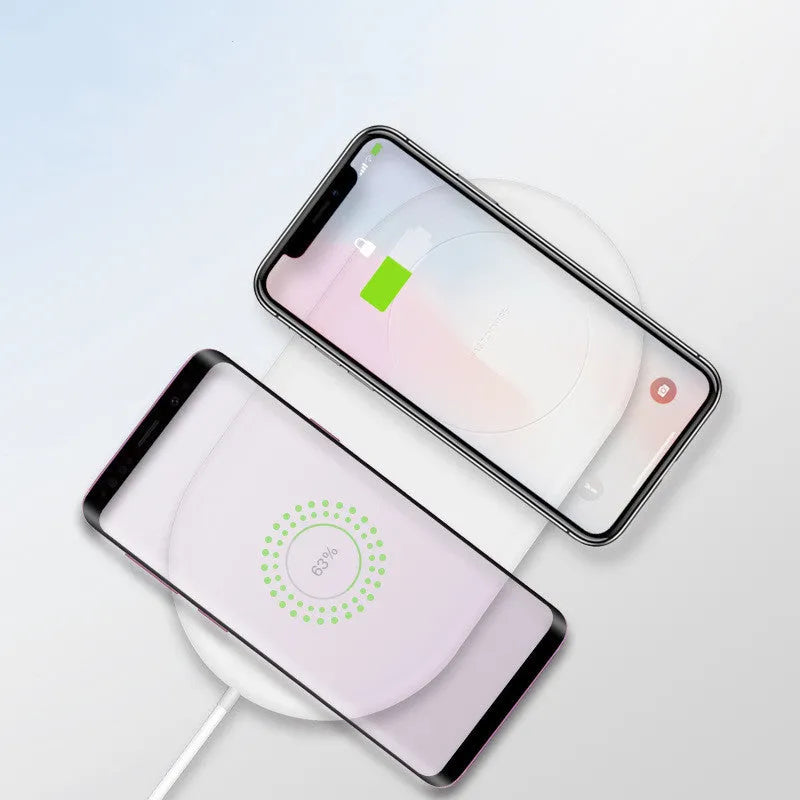 White dual wireless charging pad for two mobile phones on simple design