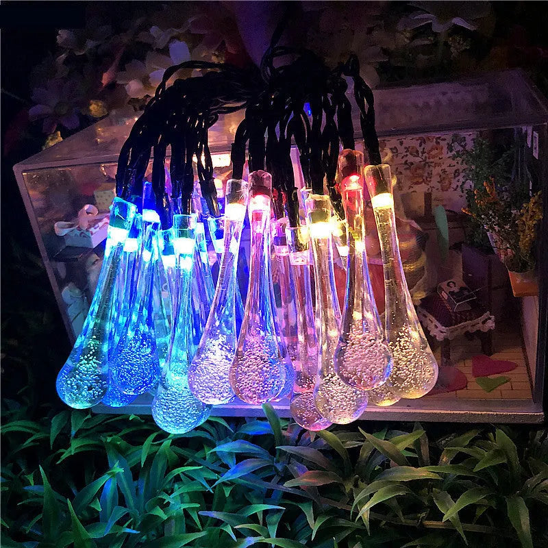 Solar-powered outdoor LED string lights with water drop pendants on 6.5m cable