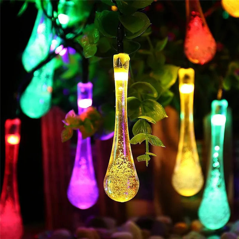 Solar-powered outdoor LED string lights with water drop pendants on 6.5m cable