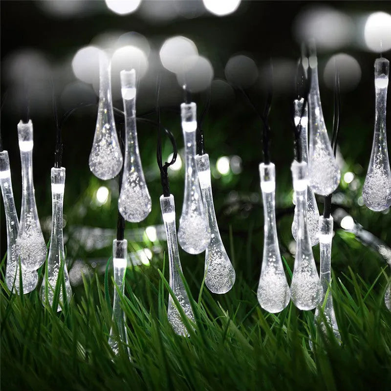 Solar-powered outdoor LED string lights with water drop pendants on 6.5m cable
