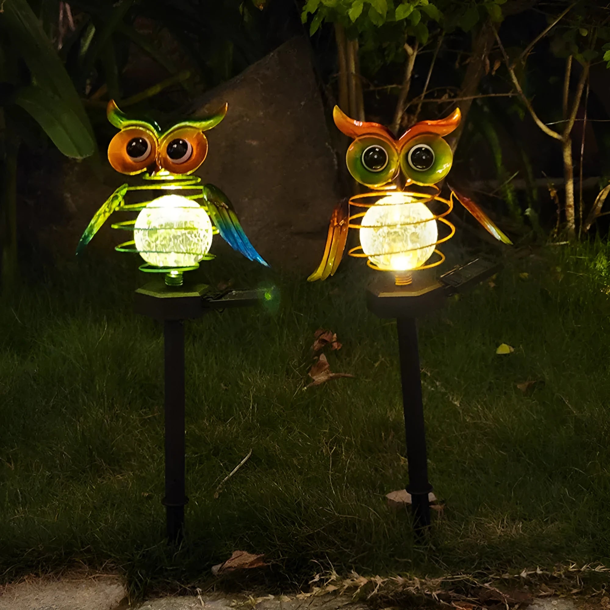 Solar owl lawn lamp with blue LED glow in garden pathway setting, 45cm tall