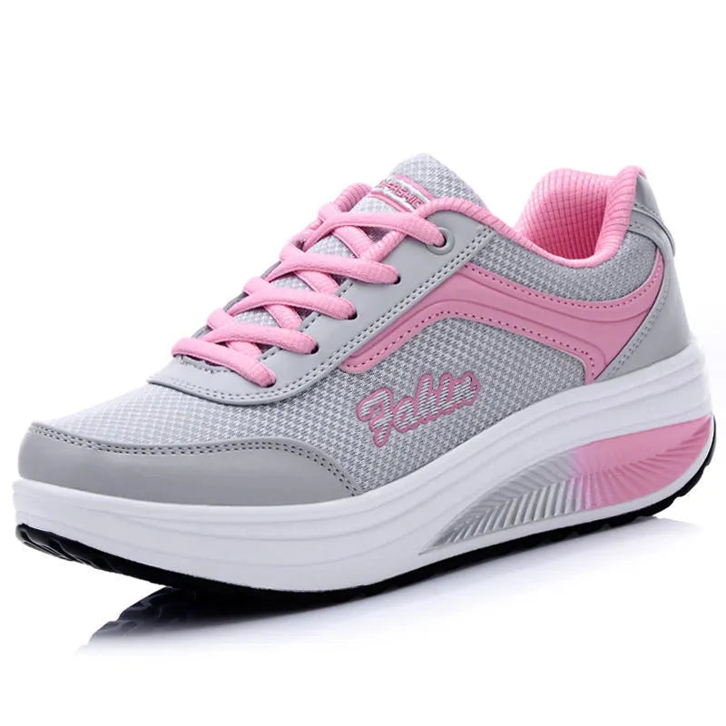 Women's black heelless sports shoes with a medium 3-5cm heel on a white background.