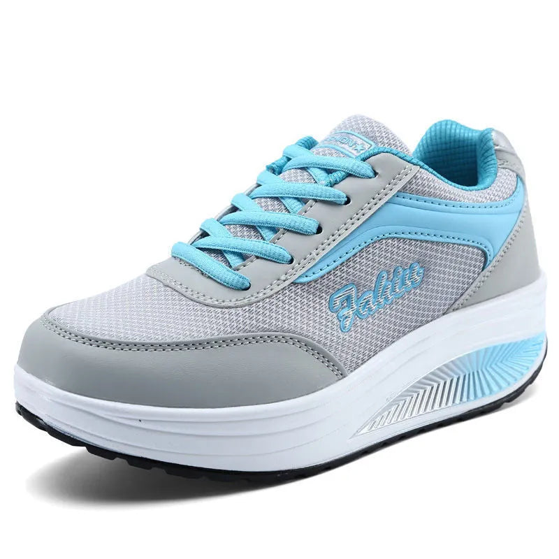 Women's black heelless sports shoes with a medium 3-5cm heel on a white background.