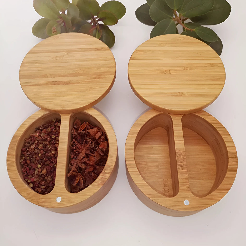 Bamboo seasoning storage box with a small bamboo spoon on a kitchen counter.