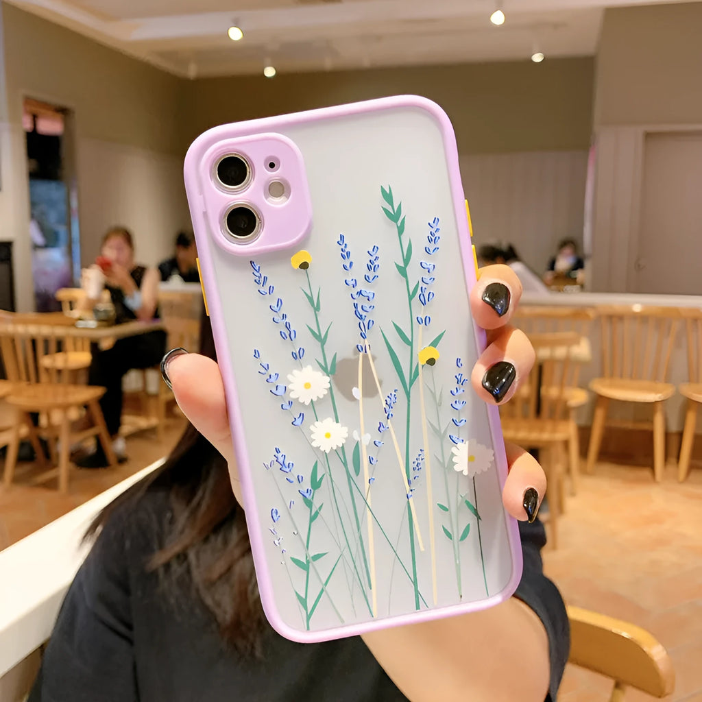 Matte pink lavender iPhone case with blue floral cartoon design and contrasting coloured frame.