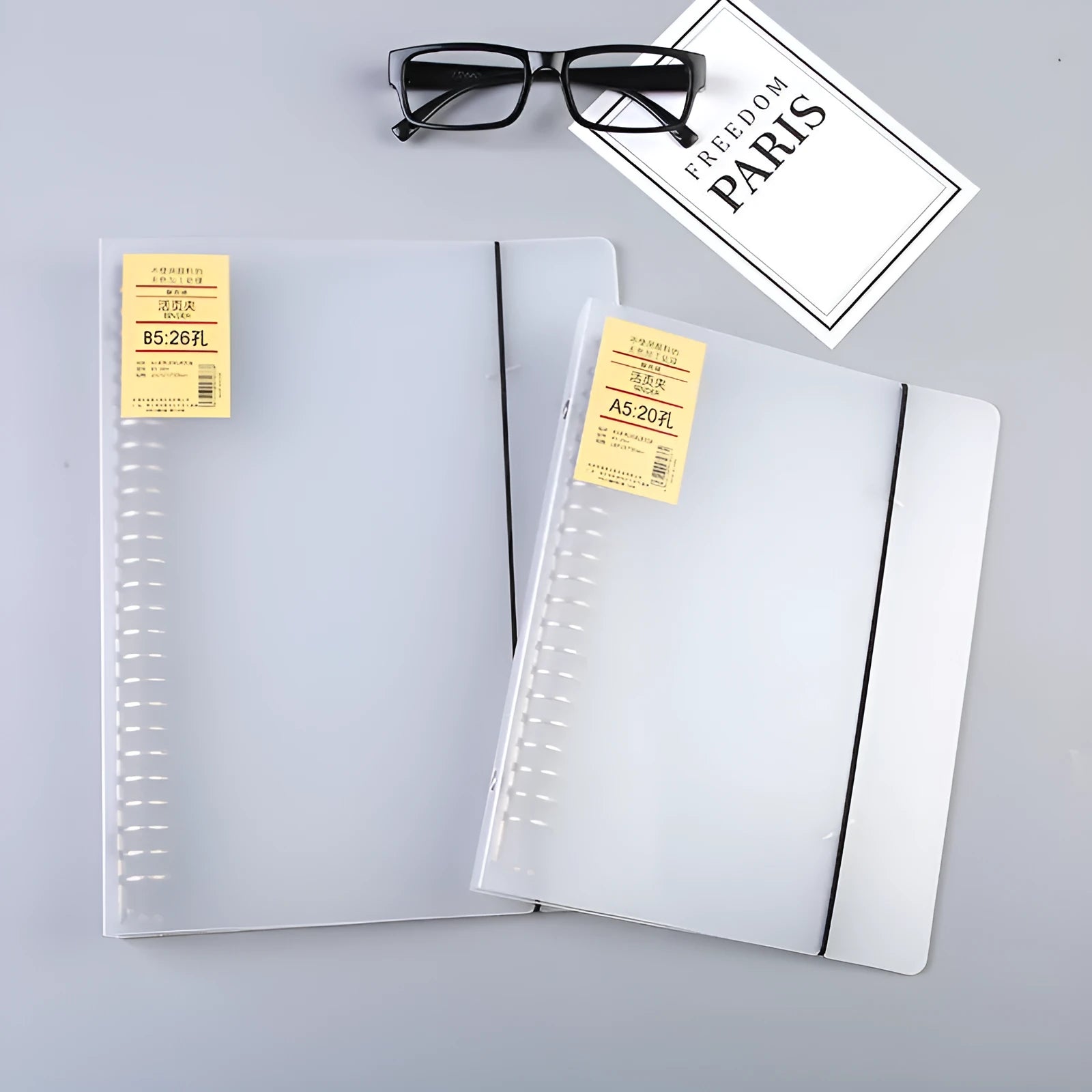 A5 26-hole binder notebook with PP matte cover showing two-ring binding mechanism and horizontal lined pages