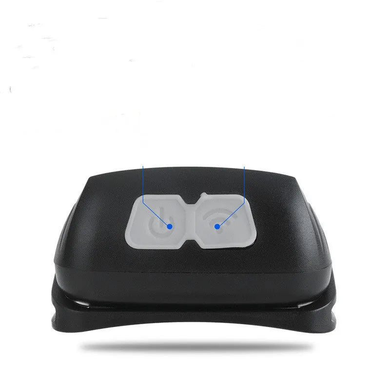 Black USB rechargeable sensor headlight with red LED safety light on adjustable strap.