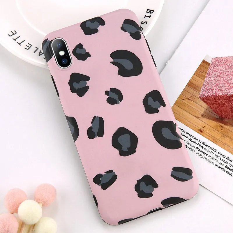 Leopard print phone case for iPhone in black, blue, and pink colours showing front and back views.