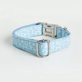Paisley polyester dog collar with zinc alloy buckle and lettering on a white background.