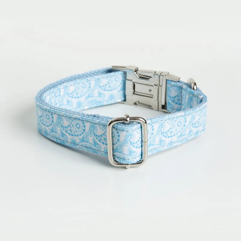 Paisley polyester dog collar with zinc alloy buckle and lettering on a white background.