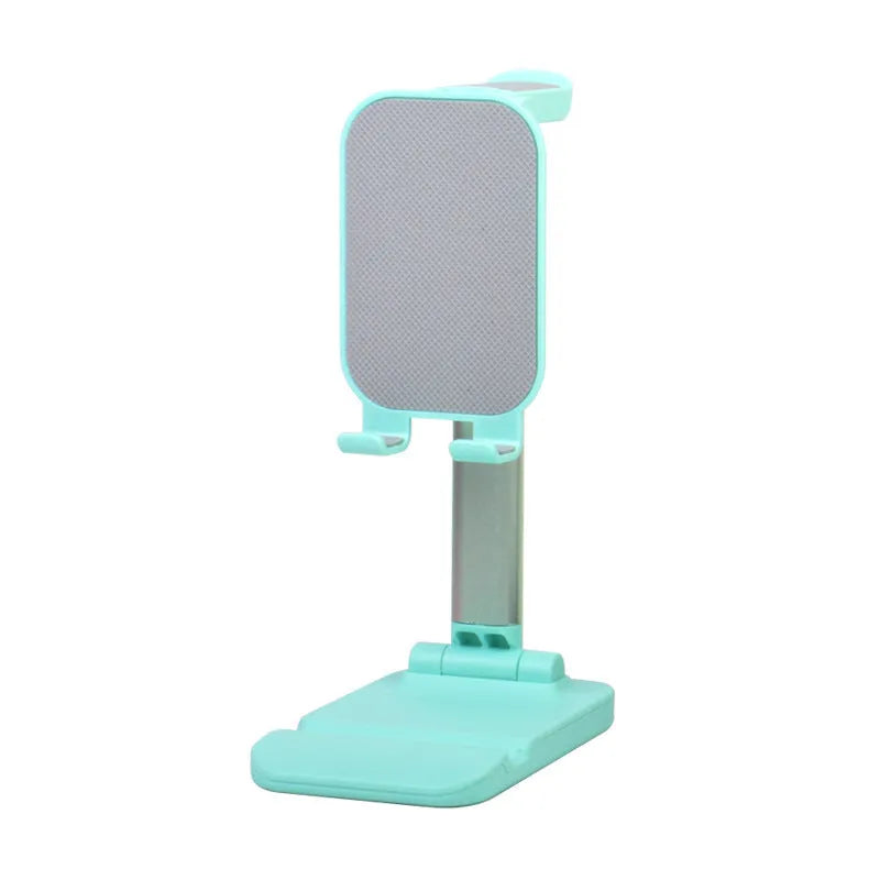 Folding mobile phone stand on a desk holding a smartphone, available in black green pink and white colours