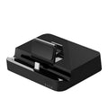 Black mobile phone to HD video converter dock on a white background