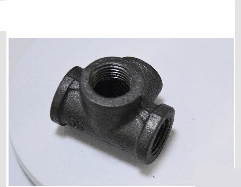 Galvanized steel four-way pipe fitting with three-dimensional corner design