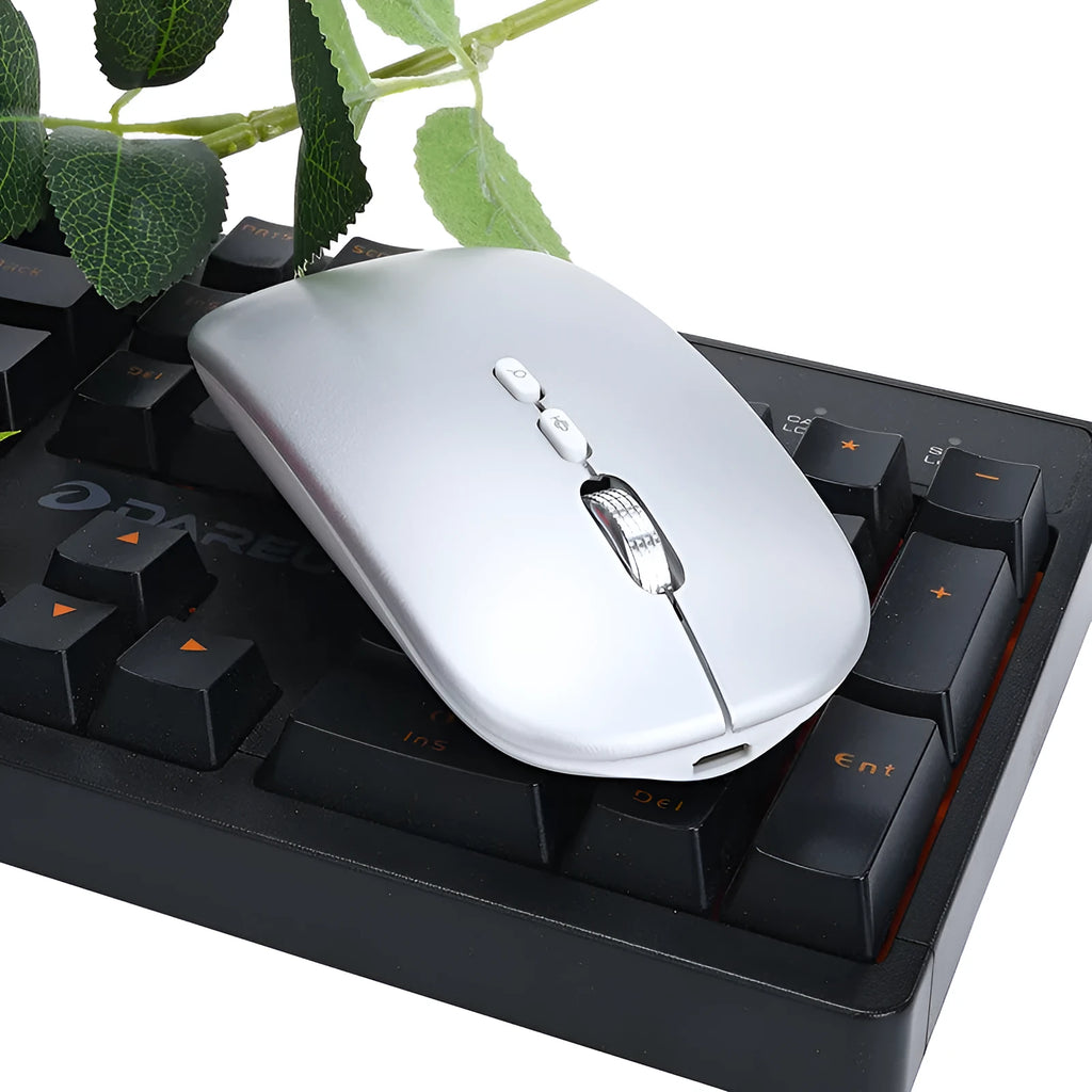 Silver intelligent voice mouse with voice typing translation and wireless charging on desk