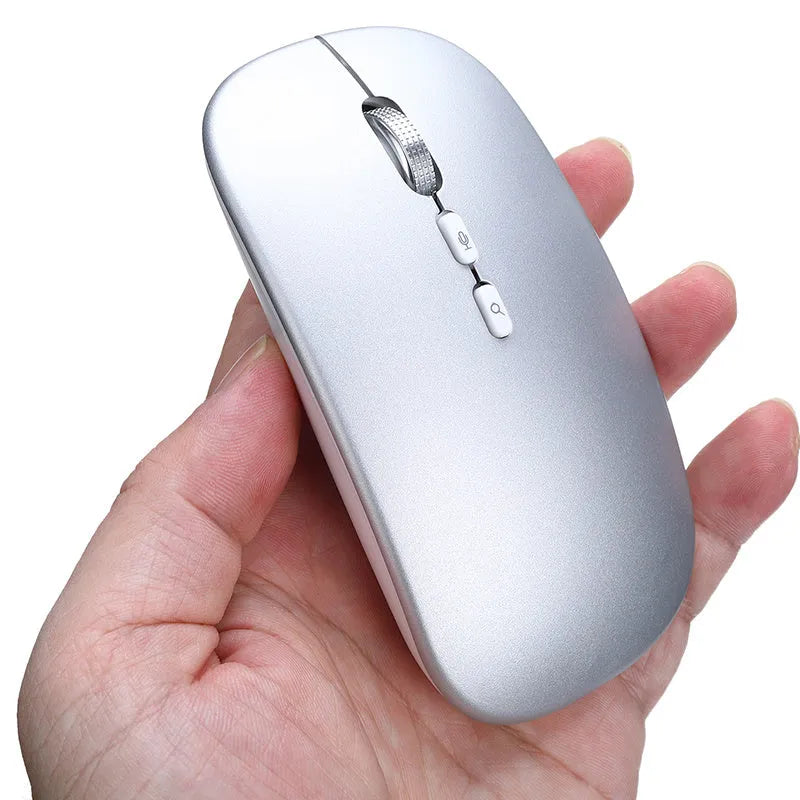 Silver intelligent voice mouse with voice typing translation and wireless charging on desk