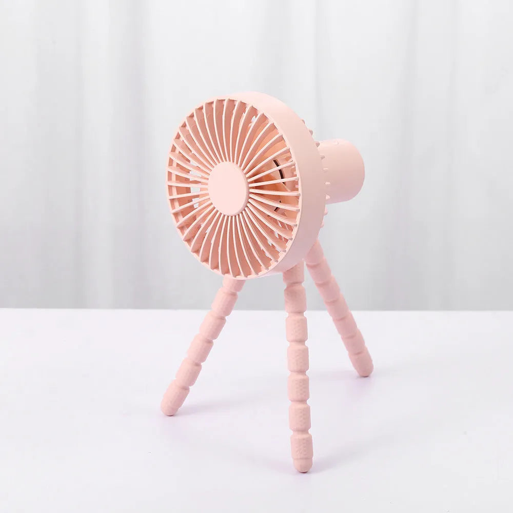 Adjustable tripod desktop fan with a bending head in black, shown in handheld and desktop positions.