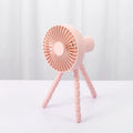 Adjustable tripod desktop fan with a bending head in black, shown in handheld and desktop positions.