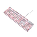 Silver and pink wired mechanical keyboard with green switches and white backlight alongside a mouse on a desk.