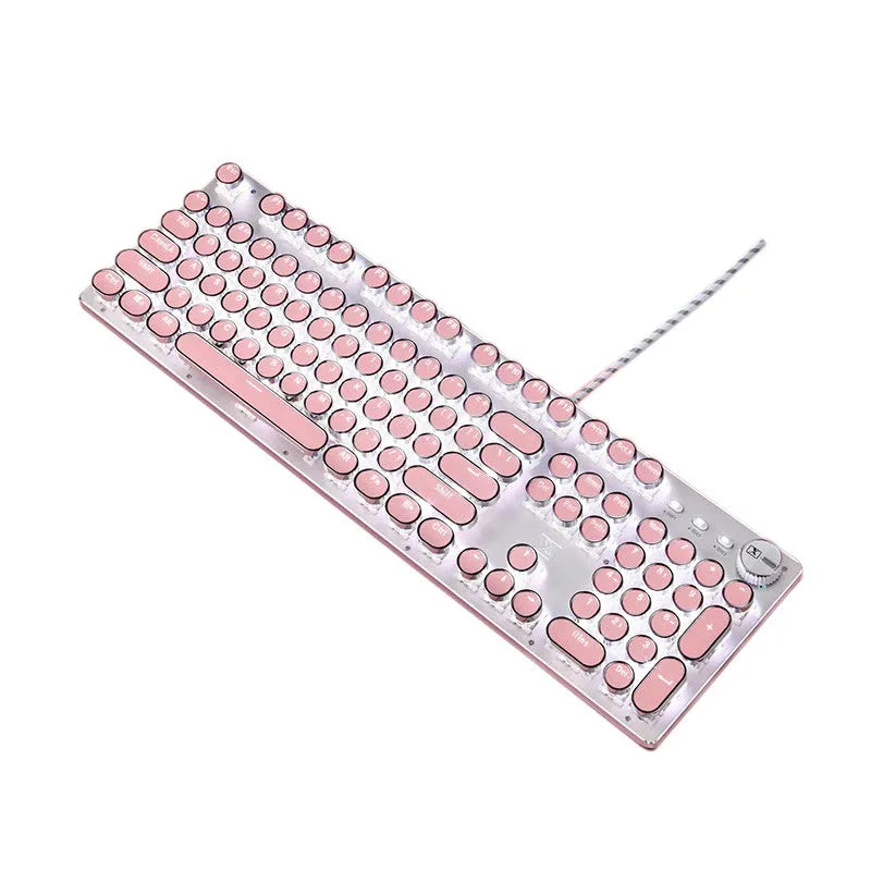 Silver and pink mechanical keyboard with green switches and white backlighting on a desk.