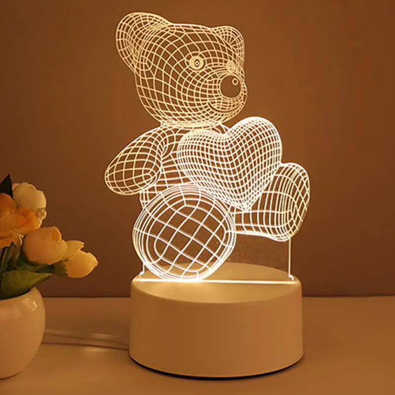 3D acrylic USB LED night light with unicorn design and warm white projection on a desk