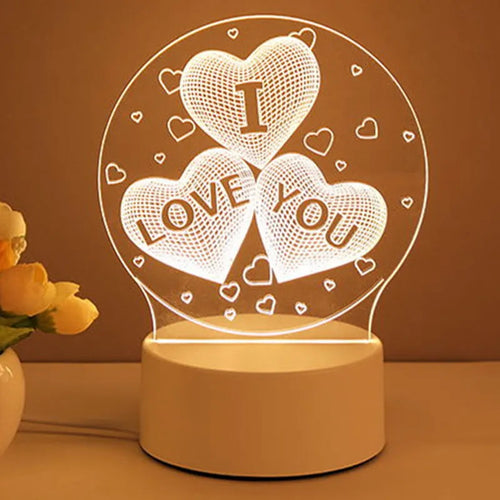 3D acrylic USB LED night light with unicorn design and warm white projection on a desk