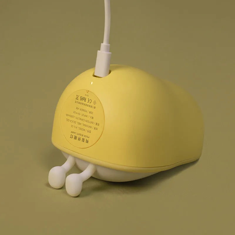 PEAR warm yellow bedside LED night lamp with ABS silicone construction showing compact design