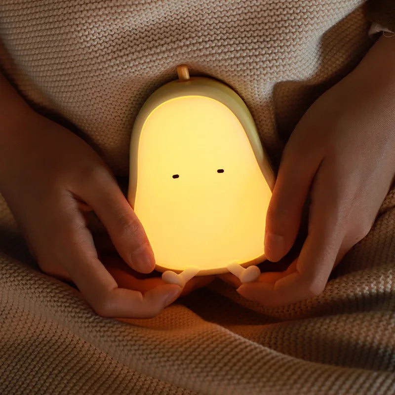 PEAR warm yellow bedside LED night lamp with ABS silicone construction showing compact design