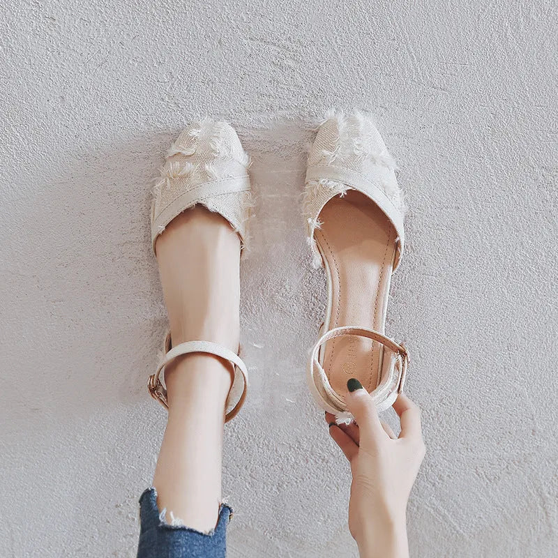 Women's apricot suede D'Orsay flats with ankle strap and low heel on a white background