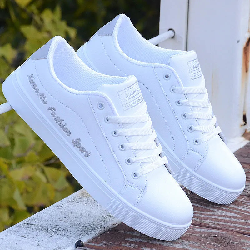 White sports casual shoes for men with lace-up closure and colourful stripe detail side view