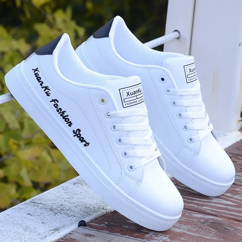 White sports casual shoes for men with lace-up closure and colourful stripe detail side view