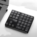 Multifunctional 35-key wireless numeric keyboard in black with USB receiver and charging cable