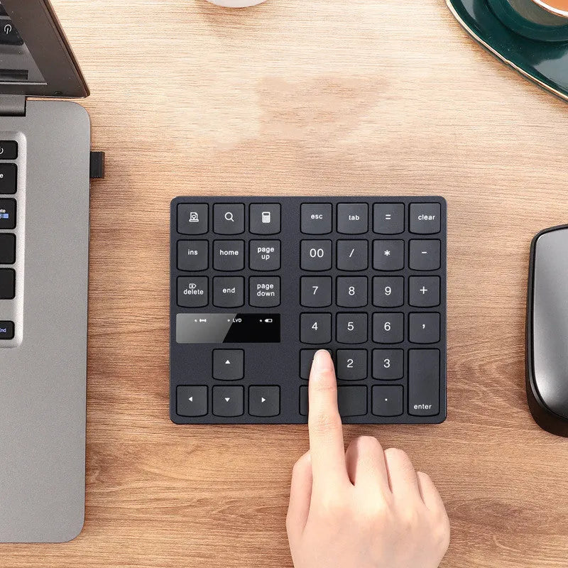 Multifunctional 35-key wireless numeric keyboard in black with USB receiver and charging cable