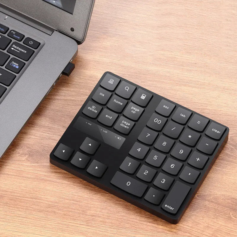 Multifunctional 35-key wireless numeric keyboard in black with USB receiver and charging cable