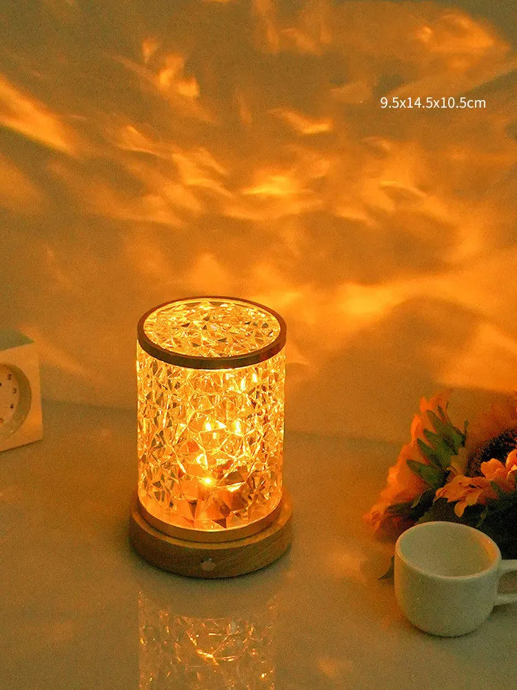 Rotating water ripple effect small night light on a solid wood base with USB cable